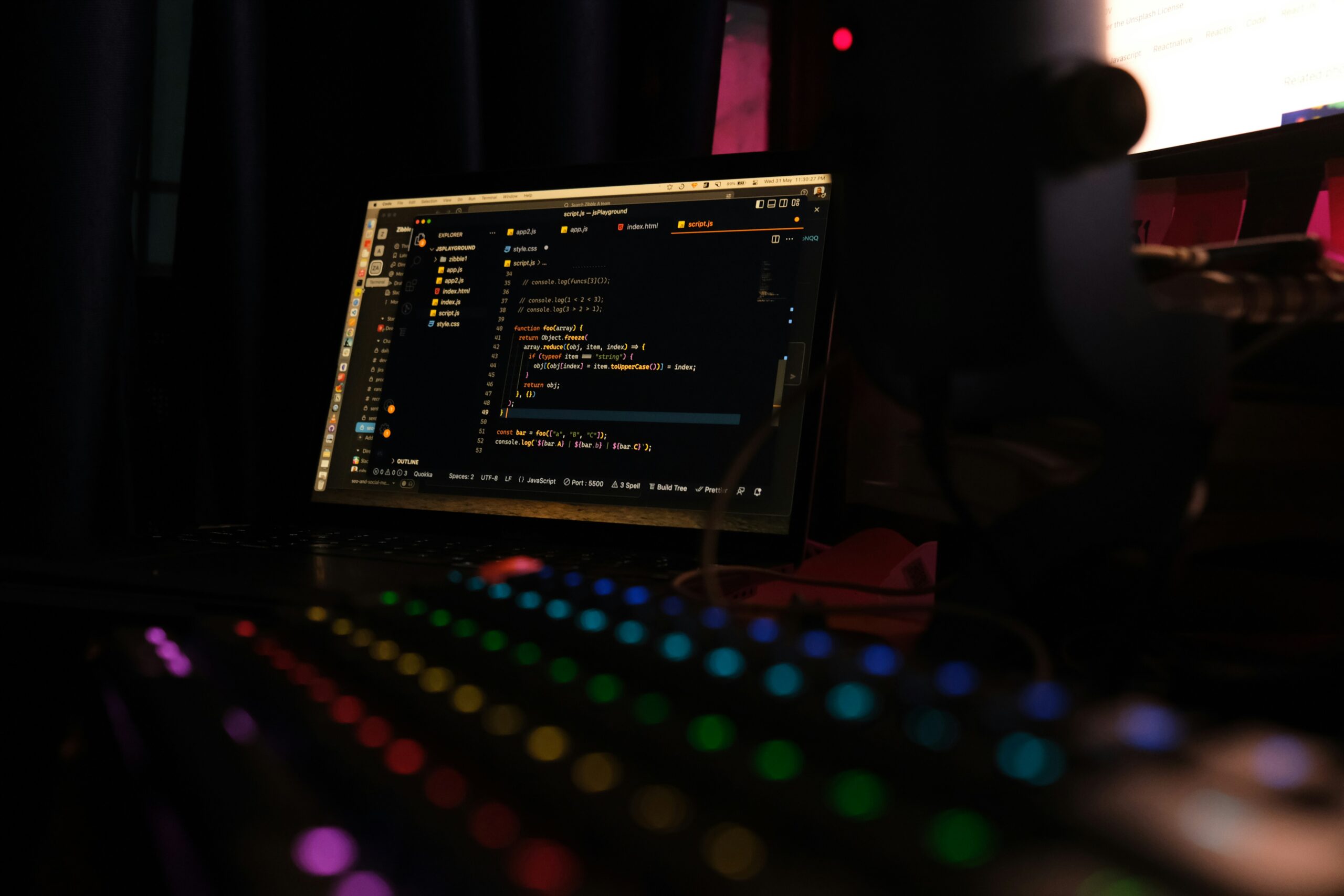 Web development coding process on laptop